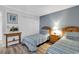 Comfortable bedroom with twin beds, wood floors and furnishings, and closet at 1581 S Waccamaw Dr. # 302, Garden City Beach, SC 29576