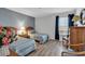 Comfortable bedroom with twin beds, wood floors and furnishings, and abundant natural light at 1581 S Waccamaw Dr. # 302, Garden City Beach, SC 29576