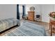 Cozy bedroom with two twin beds, wood floors and furnishings, and closet at 1581 S Waccamaw Dr. # 302, Garden City Beach, SC 29576