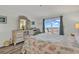 Comfortable bedroom with balcony access and ocean views at 1581 S Waccamaw Dr. # 302, Garden City Beach, SC 29576