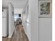 Hallway leading to the living area with ocean views and natural light at 1581 S Waccamaw Dr. # 302, Garden City Beach, SC 29576