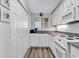 Well-equipped kitchen with white cabinets and modern appliances at 1581 S Waccamaw Dr. # 302, Garden City Beach, SC 29576