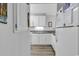 Kitchen with white cabinetry and granite countertops at 1581 S Waccamaw Dr. # 302, Garden City Beach, SC 29576