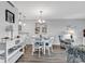Open-concept living and dining area with modern decor and bar seating at 1581 S Waccamaw Dr. # 302, Garden City Beach, SC 29576