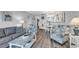 Inviting living area with open floor plan to dining and kitchen at 1581 S Waccamaw Dr. # 302, Garden City Beach, SC 29576