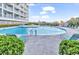 Large outdoor pool with plenty of seating for relaxation and enjoying the sunshine at 1581 S Waccamaw Dr. # 302, Garden City Beach, SC 29576