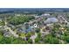 Stunning aerial view of community, showcasing lake, trees, and single-Gathering homes at 162 Jessica Lakes Dr., Conway, SC 29526
