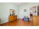 Bedroom featuring hardwood floors and a dresser with mirror at 162 Jessica Lakes Dr., Conway, SC 29526