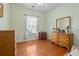 Bedroom with wood floors, light green walls, and natural light from a window at 162 Jessica Lakes Dr., Conway, SC 29526