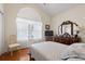 Bedroom with window with light-filtering curtains and decoratively styled dresser at 162 Jessica Lakes Dr., Conway, SC 29526