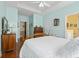 Spacious bedroom with light blue walls, wood floors, and ensuite bathroom access at 162 Jessica Lakes Dr., Conway, SC 29526