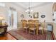 Bright dining room featuring hardwood floors, chandelier, and room for six at 162 Jessica Lakes Dr., Conway, SC 29526
