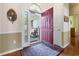 Inviting entryway with a red front door, hardwood floors, and neutral wall tones at 162 Jessica Lakes Dr., Conway, SC 29526