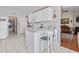 Bright kitchen with white cabinets and barstool seating at 162 Jessica Lakes Dr., Conway, SC 29526