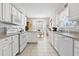 Open kitchen with white appliances and a dining nook at 162 Jessica Lakes Dr., Conway, SC 29526