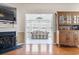 Inviting living room with a fireplace, wood floors, and sunroom access at 162 Jessica Lakes Dr., Conway, SC 29526