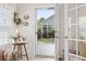 Sunroom featuring tile floors, a table, and views of the landscaped yard at 162 Jessica Lakes Dr., Conway, SC 29526