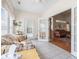 Bright sunroom offering access to a screened-in patio, neutral paint, and tile floors at 162 Jessica Lakes Dr., Conway, SC 29526