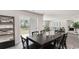 Dining area with a modern table setting, a sliding glass door, and an open view to the living space at 177 Ashworth Dr., Tabor City, NC 28463