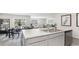 Bright, modern kitchen with an island, stainless steel appliances, open to dining and living areas at 177 Ashworth Dr., Tabor City, NC 28463