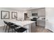 Stylish kitchen featuring an island with seating, stainless appliances, and light grey cabinets at 177 Ashworth Dr., Tabor City, NC 28463
