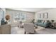 Inviting living room with modern decor, comfortable seating, and large windows for ample natural light at 177 Ashworth Dr., Tabor City, NC 28463