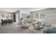Open-concept living room and dining area featuring hardwood floors and stylish decor at 177 Ashworth Dr., Tabor City, NC 28463