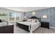 Comfortable main bedroom with patterned wallpaper and large window offering plenty of light at 177 Ashworth Dr., Tabor City, NC 28463