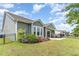 Beautifully landscaped backyard with flower beds, patio and lawn, perfect for outdoor enjoyment at 1827 Parish Way, Myrtle Beach, SC 29577