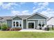 Inviting backyard featuring a patio, green lawn, and tasteful landscaping with colorful flowers at 1827 Parish Way, Myrtle Beach, SC 29577