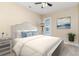 Inviting bedroom with a ceiling fan, a cozy rug, soft lighting, and a soothing color scheme at 1827 Parish Way, Myrtle Beach, SC 29577