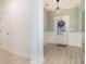 Welcoming entryway featuring light-colored wood floors, wainscoting, and a decorative light fixture at 1827 Parish Way, Myrtle Beach, SC 29577
