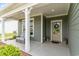 Inviting front porch featuring comfortable seating and a charming entrance door with decorative wreath at 1827 Parish Way, Myrtle Beach, SC 29577