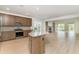 Modern kitchen with stainless steel appliances and granite counters overlooking the living room at 1827 Parish Way, Myrtle Beach, SC 29577