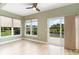 Cozy sunroom featuring large windows with views of the backyard and water at 1827 Parish Way, Myrtle Beach, SC 29577