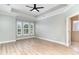 Primary bedroom featuring neutral paint, light floors, a ceiling fan, and lots of natural light at 1827 Parish Way, Myrtle Beach, SC 29577