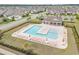Aerial shot of community pool with lounge chairs and tables, surrounded by a well-maintained fence at 1827 Parish Way, Myrtle Beach, SC 29577