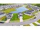 Aerial view of a neighborhood with a lake and beautifully landscaped homes at 189 Timber Oaks Dr., Myrtle Beach, SC 29588