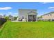 Large, green backyard with a patio area and black aluminum fencing at 189 Timber Oaks Dr., Myrtle Beach, SC 29588