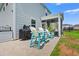 Outdoor patio with grill and Adirondack chairs offering comfortable entertaining space at 189 Timber Oaks Dr., Myrtle Beach, SC 29588