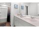 This bathroom includes dual sinks, a full mirror, and shower-tub combination in a bright space at 189 Timber Oaks Dr., Myrtle Beach, SC 29588