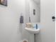 This bathroom features a pedestal sink with a mirror, perfect for guests at 189 Timber Oaks Dr., Myrtle Beach, SC 29588