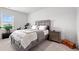 Relax in this bedroom featuring a comfortable king bed, an exercise bike, and bedside tables at 189 Timber Oaks Dr., Myrtle Beach, SC 29588