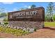 Elegant community sign for Cooper's Bluff, highlighting 'The Highlands & Waterside' at 189 Timber Oaks Dr., Myrtle Beach, SC 29588
