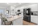 Modern kitchen featuring stainless steel appliances, granite countertops and a central island with seating at 189 Timber Oaks Dr., Myrtle Beach, SC 29588