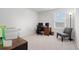 A home office space with a dark desk, ergonomic chair, and a printer at 189 Timber Oaks Dr., Myrtle Beach, SC 29588