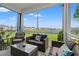 Relaxing screened-in patio with comfortable seating and serene lake views at 189 Timber Oaks Dr., Myrtle Beach, SC 29588