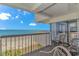 Relax on this condo balcony, enjoying ocean views, and comfortable seating at 200 72Nd Ave. N # 501, Myrtle Beach, SC 29572