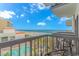 Relaxing balcony view of the ocean, beach and pool below on a bright, sunny day at 200 72Nd Ave. N # 501, Myrtle Beach, SC 29572