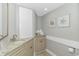 Charming bathroom with granite countertop vanity, decorative wall art, and beachy accents at 200 72Nd Ave. N # 501, Myrtle Beach, SC 29572